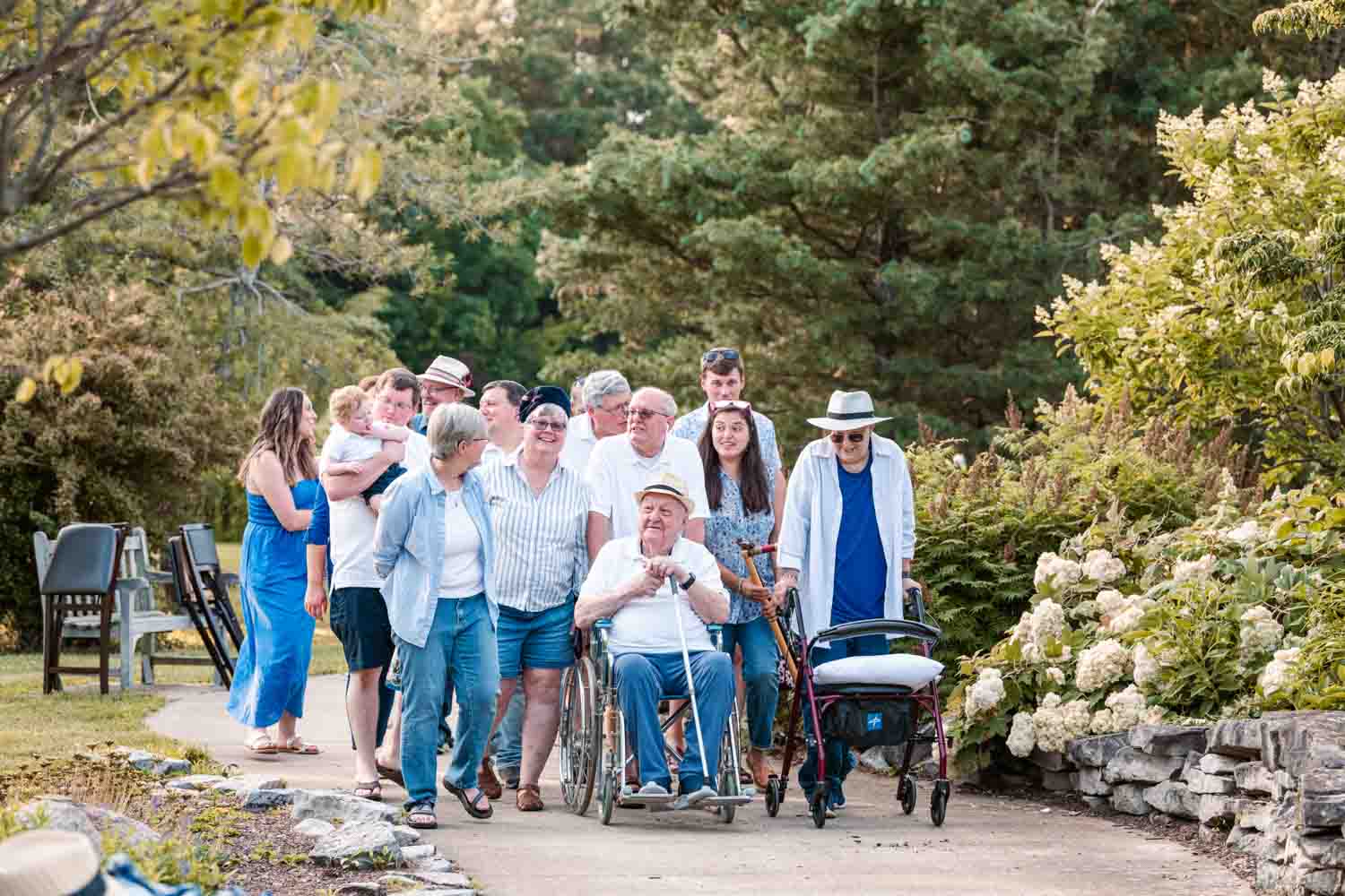 Picture of family walking with Grandpa in a wheelchair