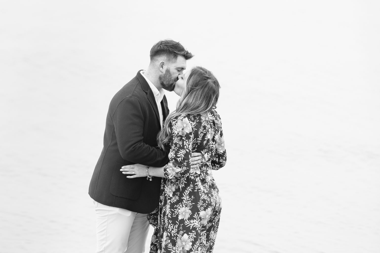 Man kissing woman after proposing