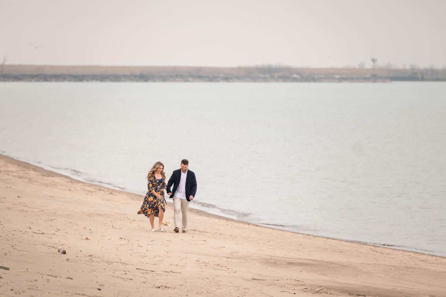 Couple walking down the beach